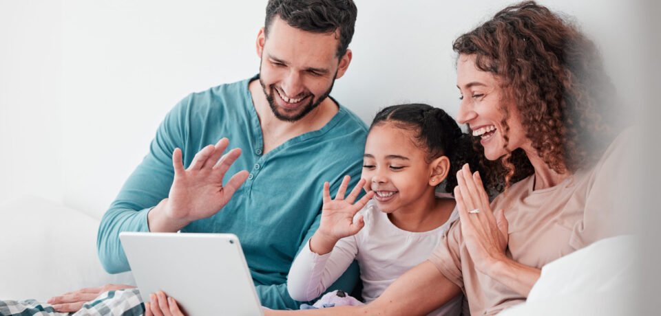 Love, video call and family in bed, smile or conversation online with tablet, bonding or chatting. .